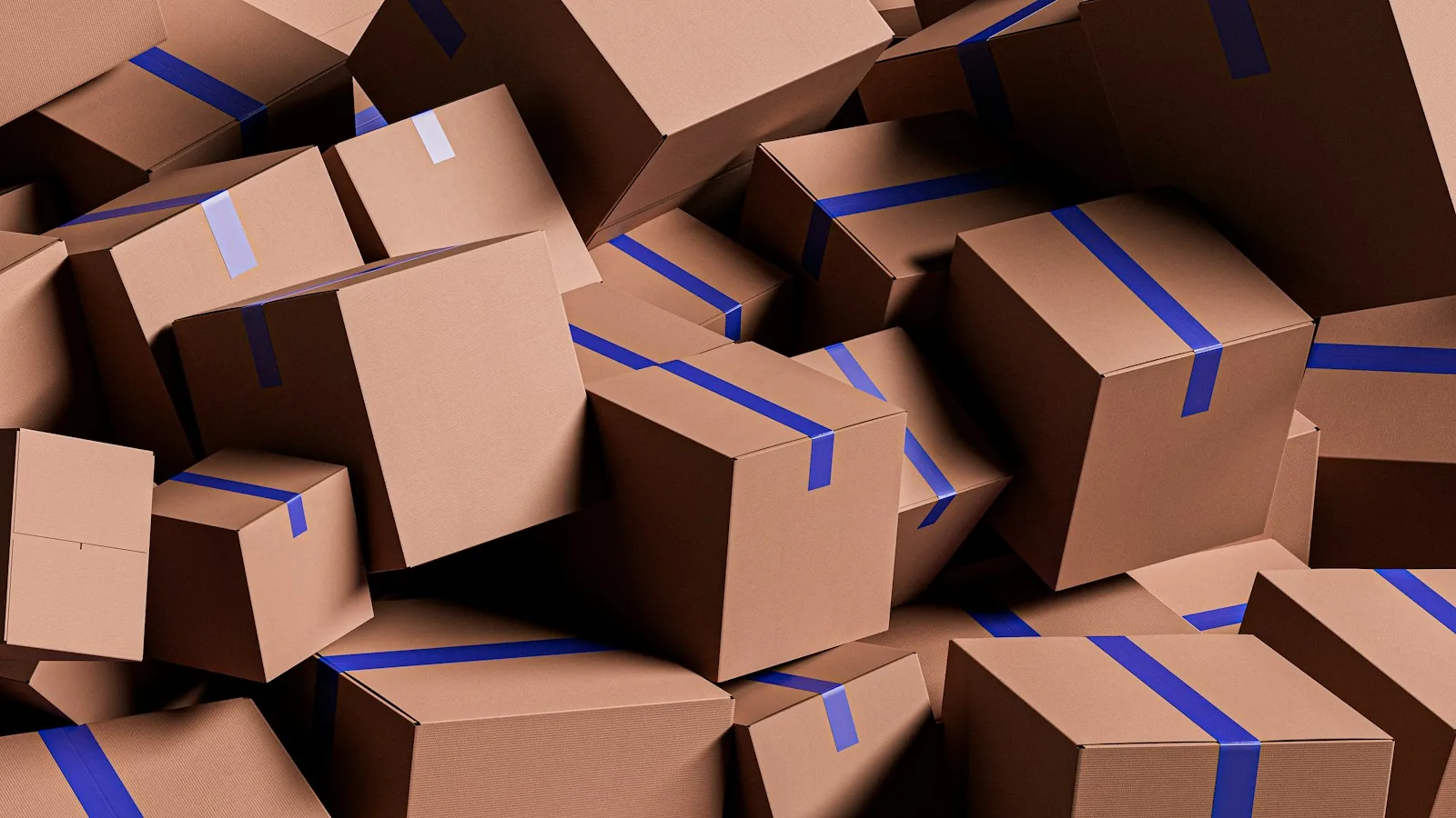 Pile of brown cardboard shipping boxes sealed with blue packing tape