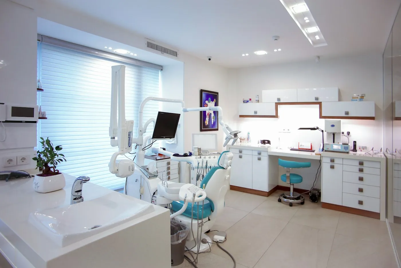 Modern dental treatment suite with a patient chair