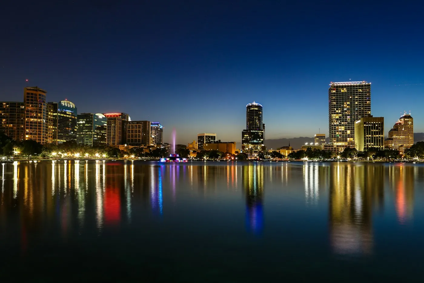 Downtown Orlando skyline reflected in the lake at night