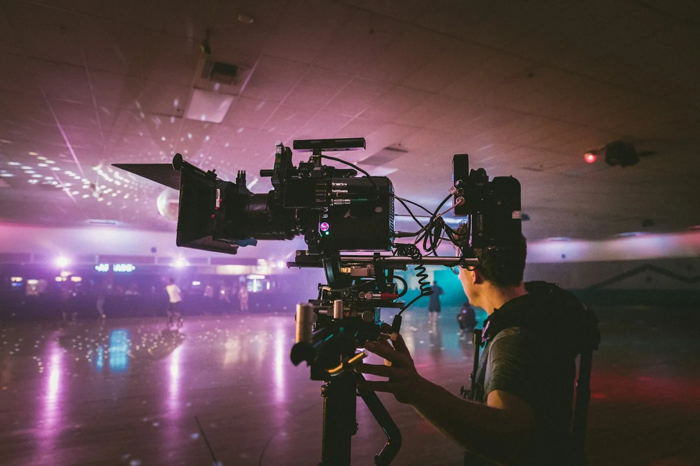 Video crew shooting a scene on a lit studio set